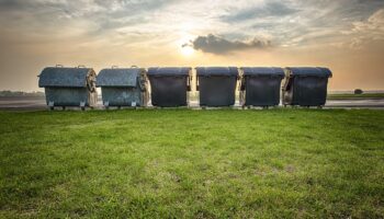 trash cans in the sunset