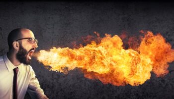 man breathing fire