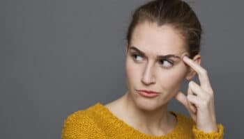 unhappy young woman looking dubious,expressing confusion and mistrust