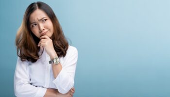 Woman feel confused isolated over blue background